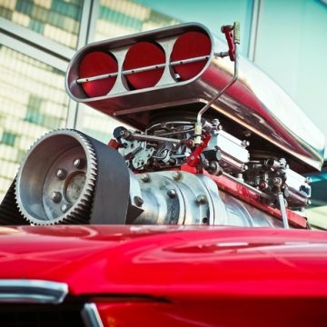 A red car similar to the ones that are financed by Woodside Credit.